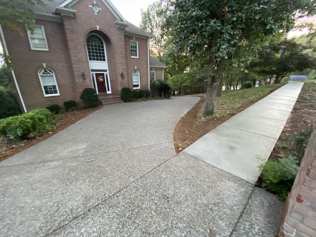 Concrete driveway and sidewalk work by Los Pumas Concrete