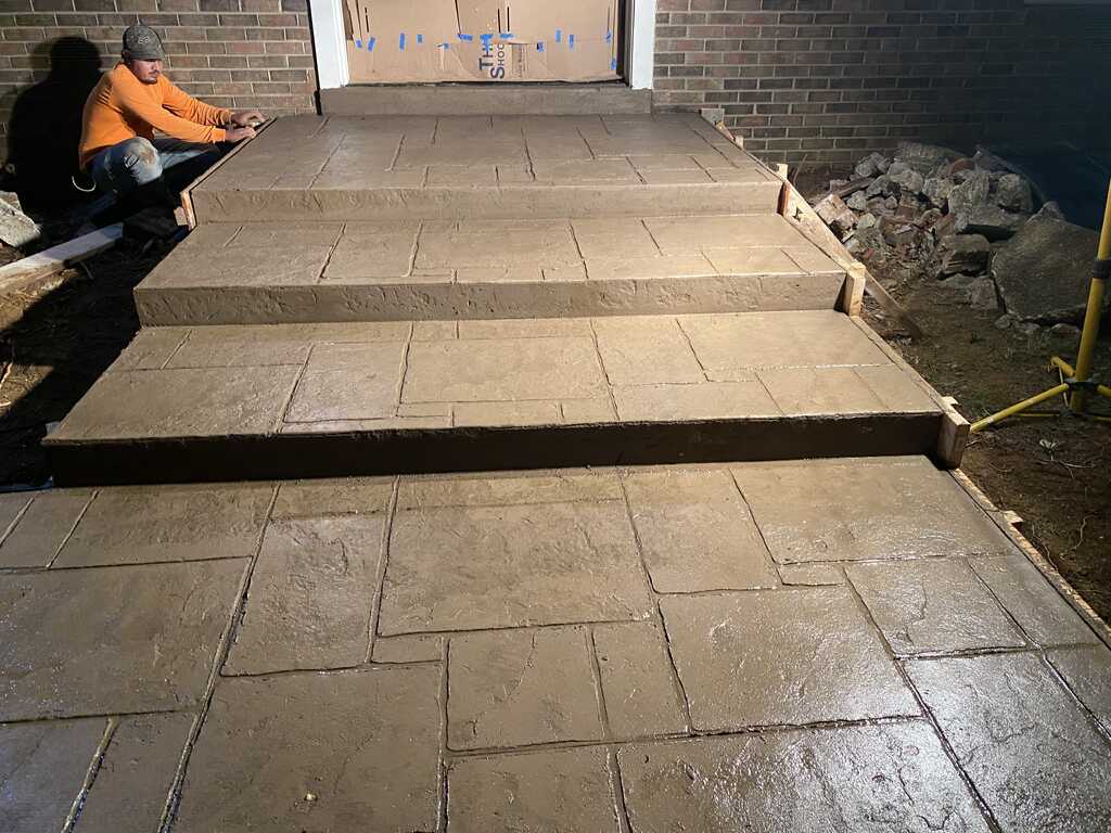 Stamped concrete steps during a Los Pumas project